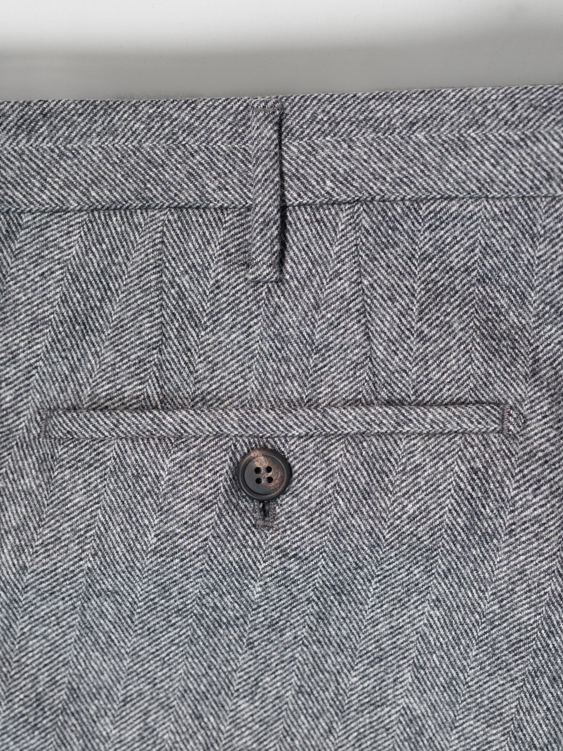 Pantaloni in flanella grigia a spina di pesce