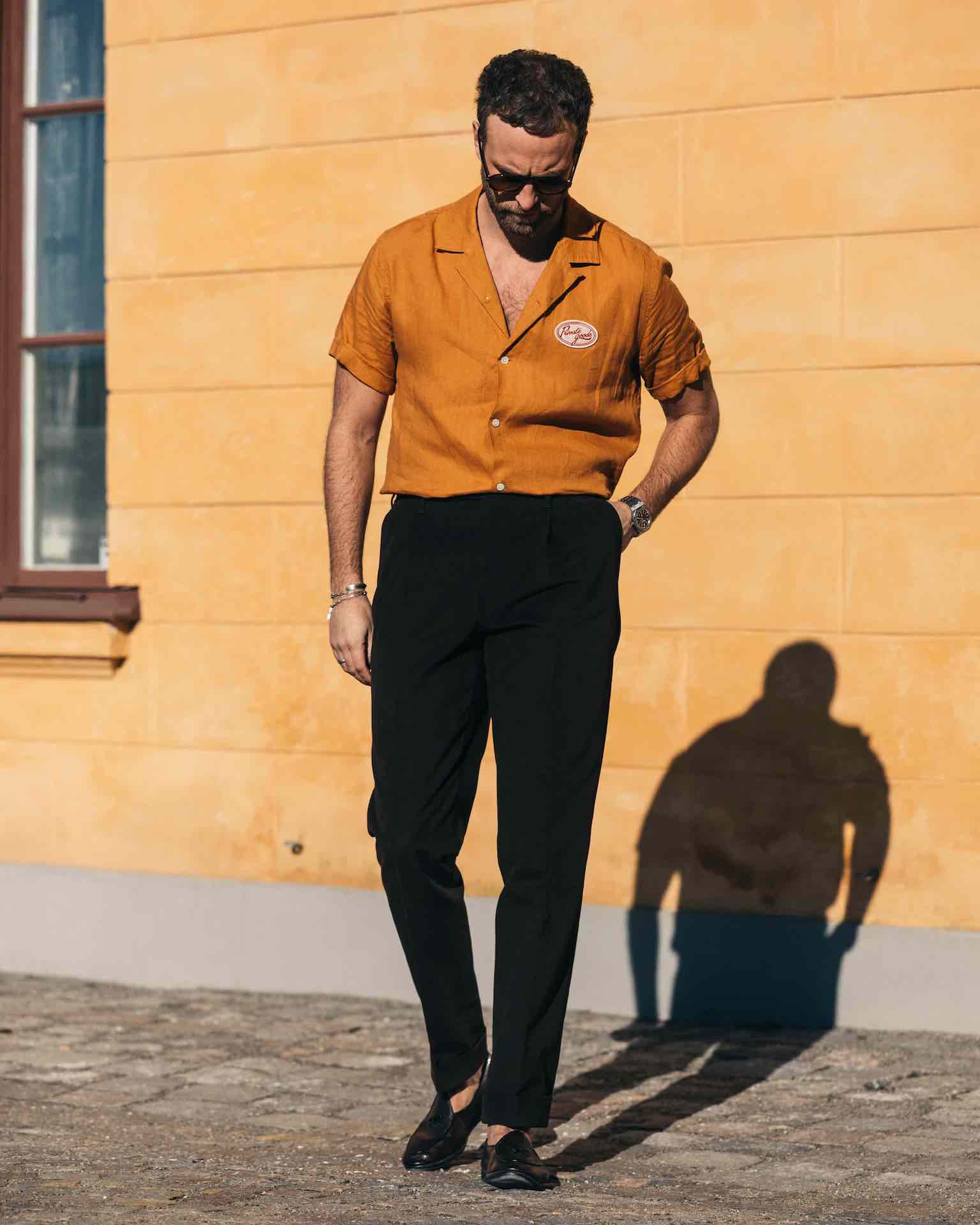 Dark brown pair of regular fit cotton trousers